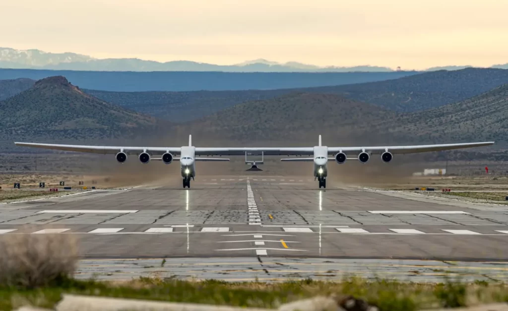 Stratolaunch's double fusilage plane sits on a runway