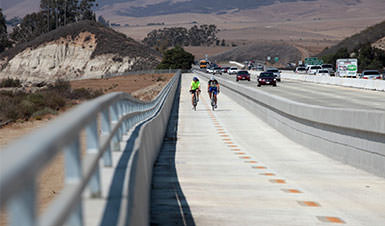 Two people riding on a bike path in San Luis Obispo